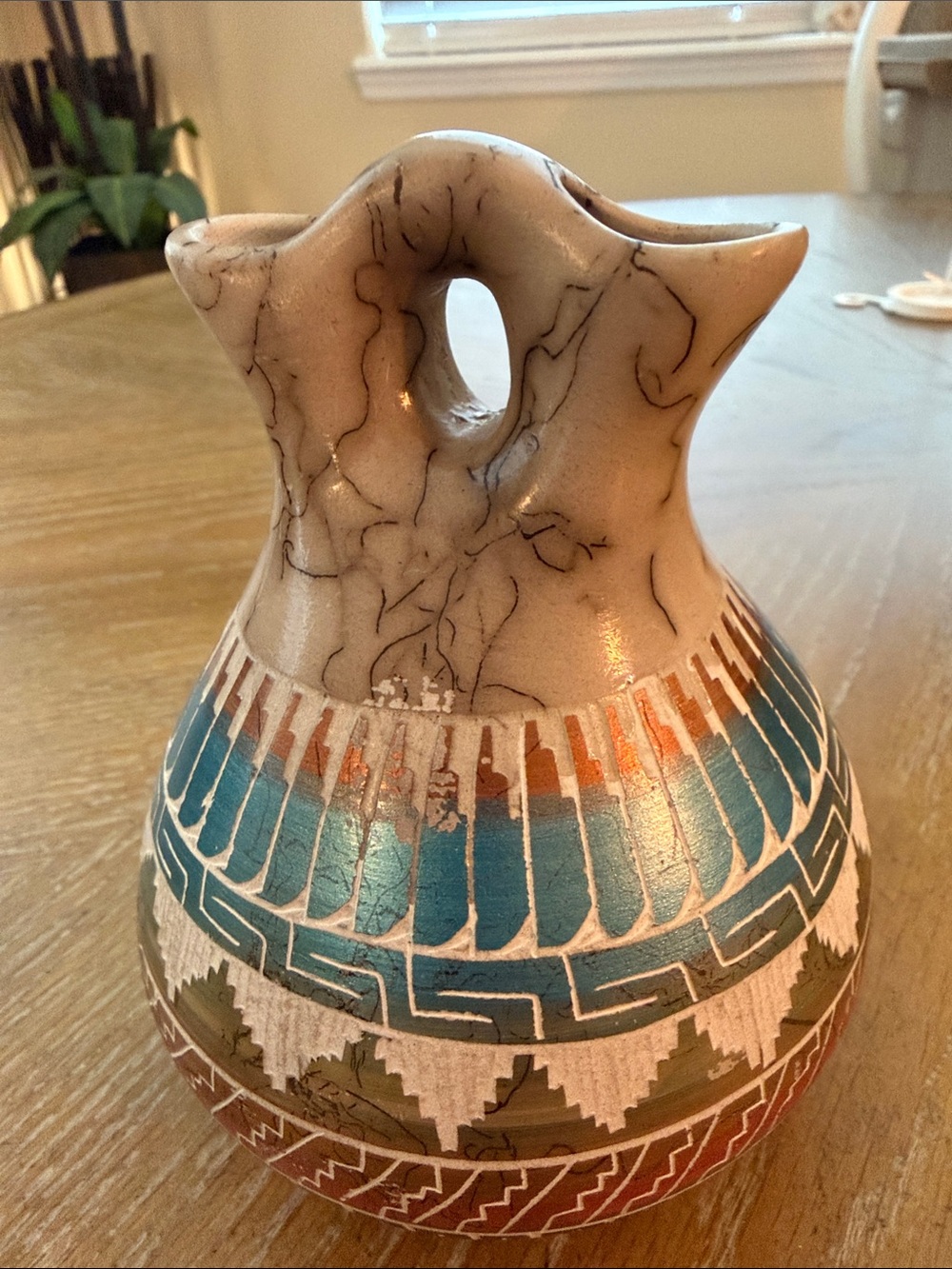 This is a Native American Navajo horse hair wedding vase hand-painted pottery.
